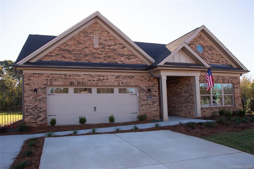 3002 Portico Place, Unit 38 Tega Cay, SC 29708 - Photo 3 of 38 front view of a house with a yard