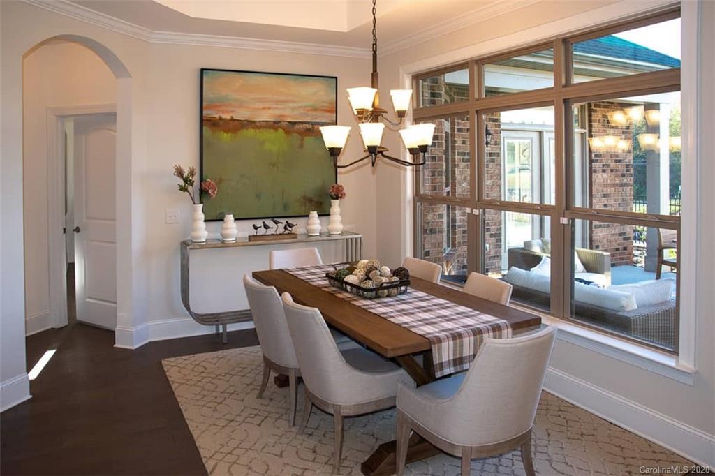 3002 Portico Place, Unit 38 Tega Cay, SC 29708 - Photo 25 of 38 a view of a dining room with furniture window and outside view