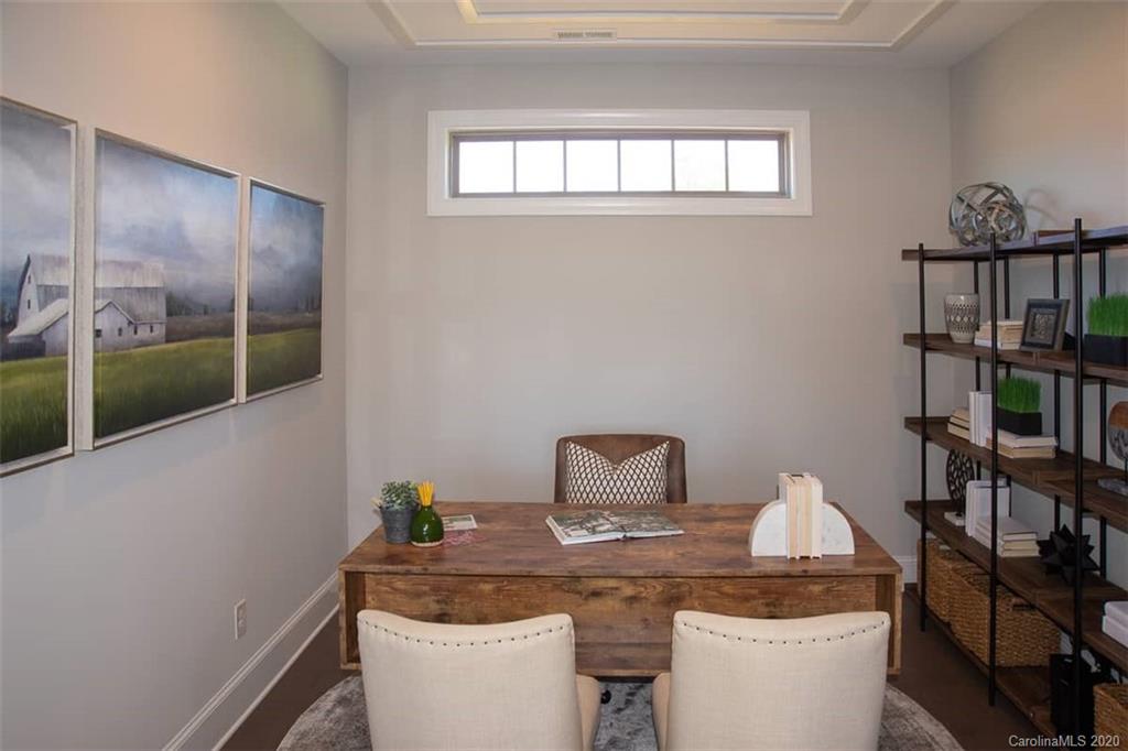 3002 Portico Place, Unit 38 Tega Cay, SC 29708 - Photo 27 of 38 a room with a table chairs and entryway