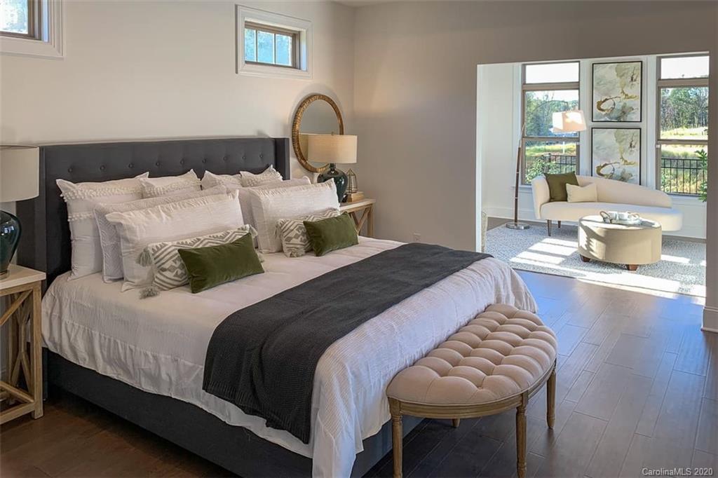 3002 Portico Place, Unit 38 Tega Cay, SC 29708 - Photo 36 of 38 a bedroom with bed and a window