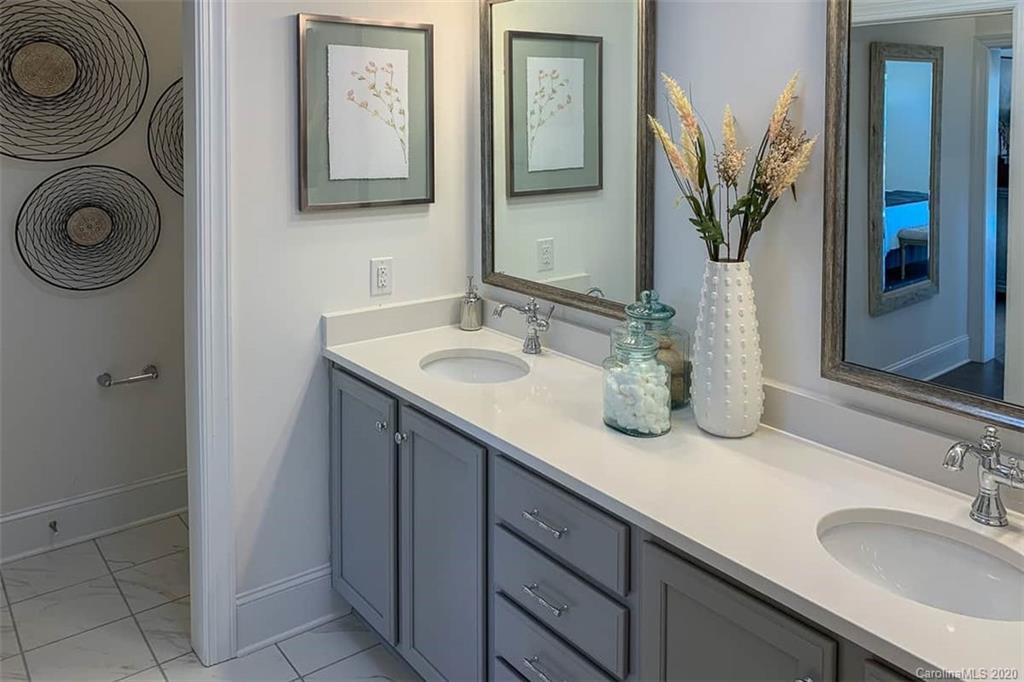 3002 Portico Place, Unit 38 Tega Cay, SC 29708 - Photo 37 of 38 a bathroom with a sink and a mirror