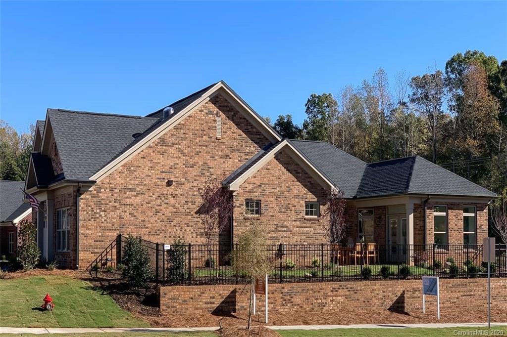 3002 Portico Place, Unit 38 Tega Cay, SC 29708 - Photo 5 of 38 front view of a house with a yard