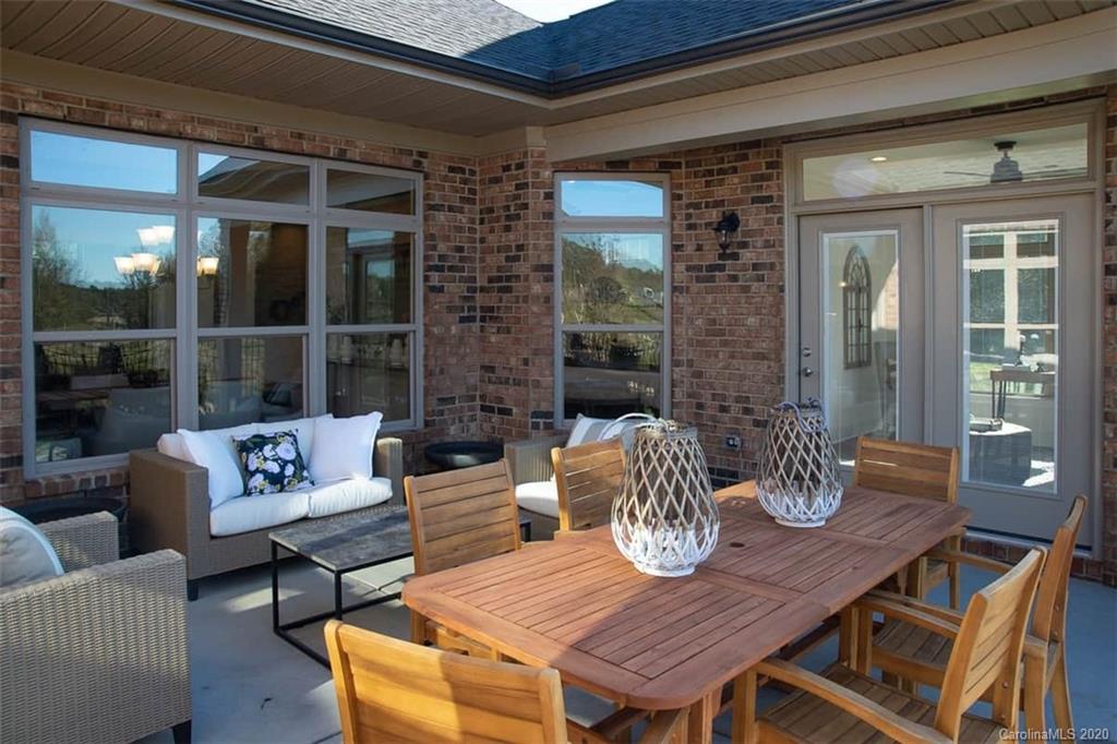 3002 Portico Place, Unit 38 Tega Cay, SC 29708 - Photo 7 of 38 a outdoor living space with furniture and window