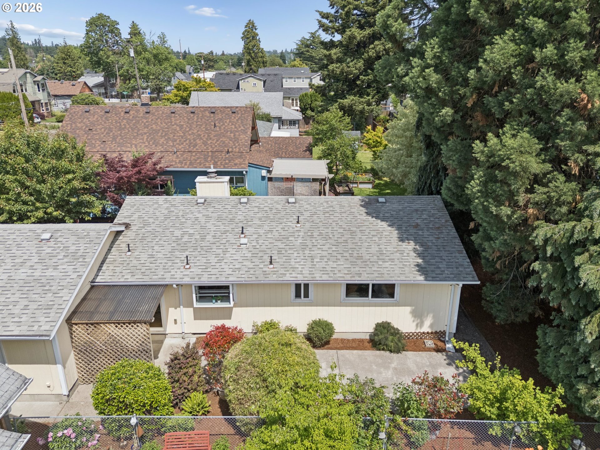 255 West Berkeley Street Gladstone, OR 97027 - Photo 35 of 37 an aerial view of a house with a yard and sitting area