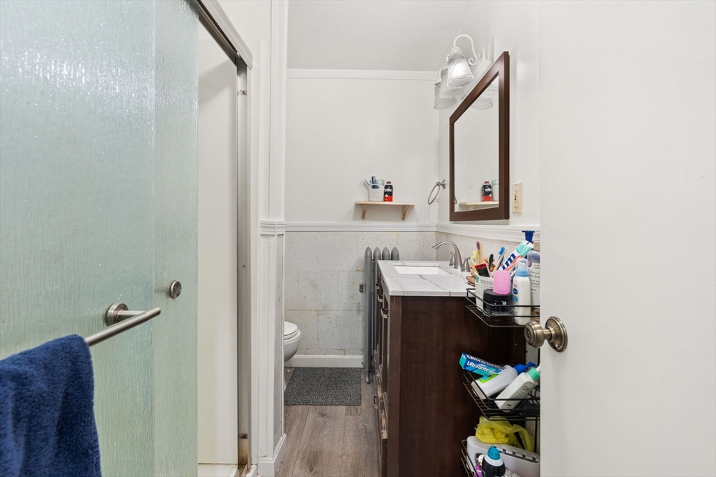 80 Ferry Street, Unit 80A Lawrence, MA 01841 - Photo 13 of 38 a bathroom with a sink and mirror