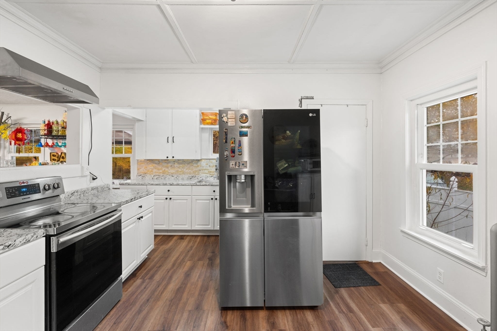 80 Ferry Street, Unit 80A Lawrence, MA 01841 - Photo 22 of 38 a kitchen with stainless steel appliances granite countertop a stove and a refrigerator