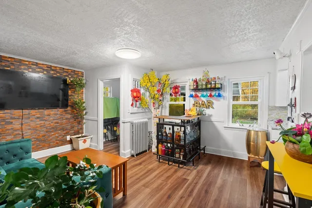 a view of room with furniture and flat screen tv