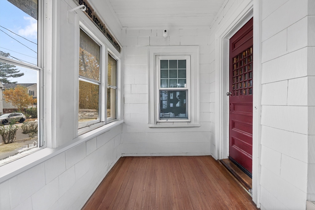 80 Ferry Street, Unit 80A Lawrence, MA 01841 - Photo 31 of 38 a view of an empty room with wooden floor and a window