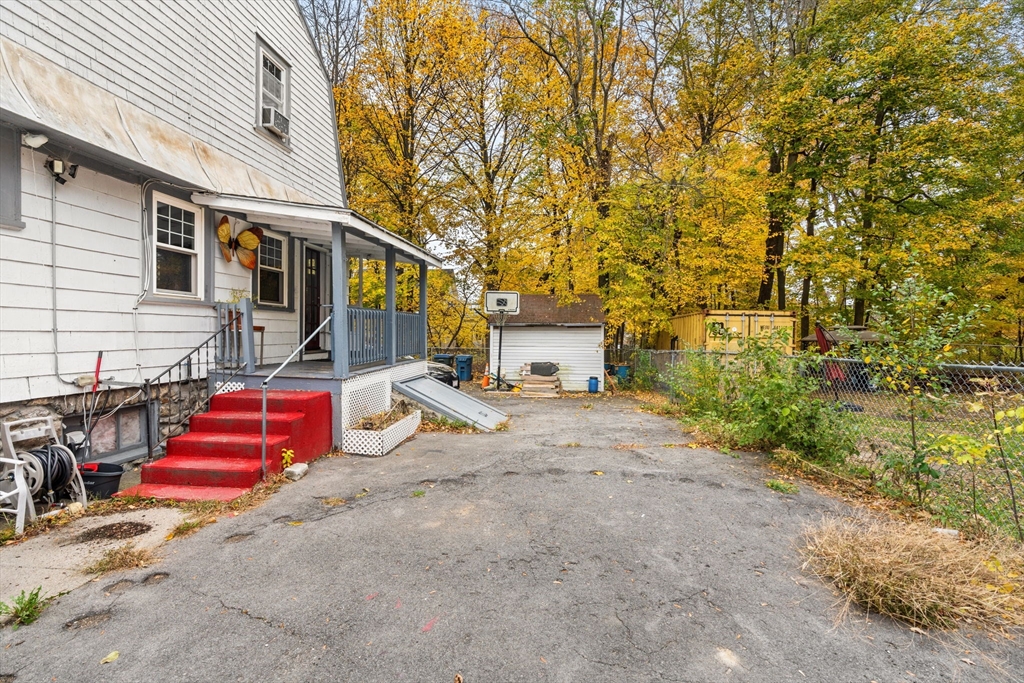 80 Ferry Street, Unit 80A Lawrence, MA 01841 - Photo 5 of 38 a view of backyard of the house