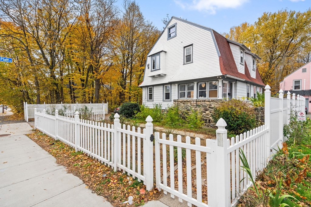 80 Ferry Street, Unit 80A Lawrence, MA 01841 - Photo 6 of 38 a view of a house with wooden fence