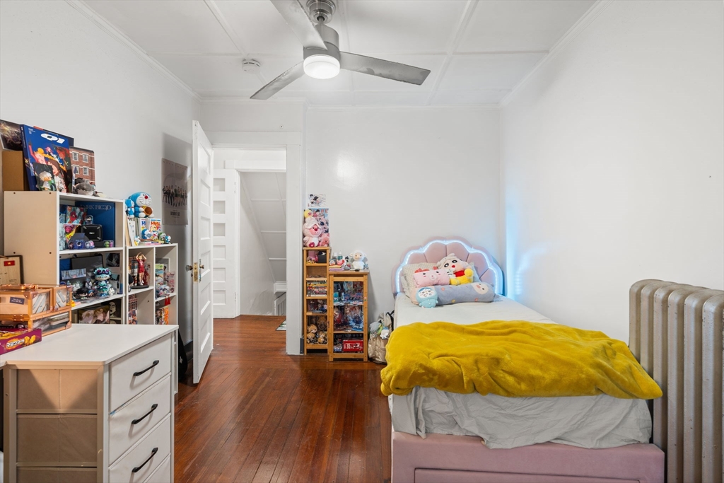 80 Ferry Street, Unit 80A Lawrence, MA 01841 - Photo 8 of 38 a bed room with a bed and a tv