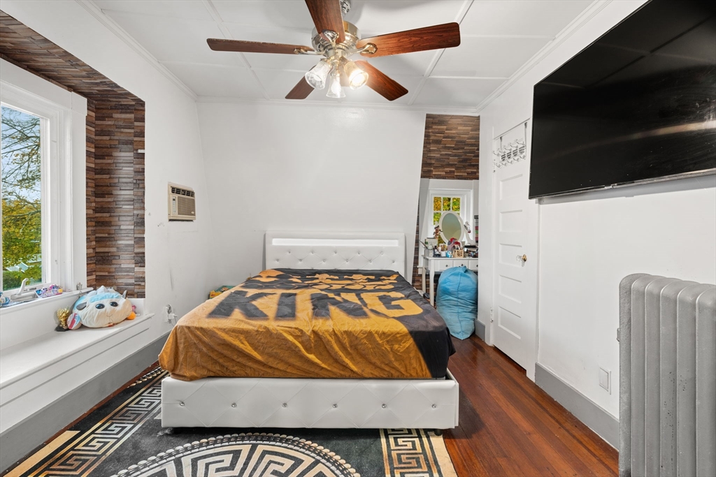 80 Ferry Street, Unit 80A Lawrence, MA 01841 - Photo 9 of 38 a bedroom with a bed and flat screen tv