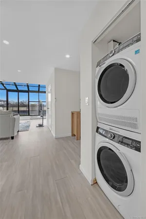 a view of a storage & utility room with washer and dryer