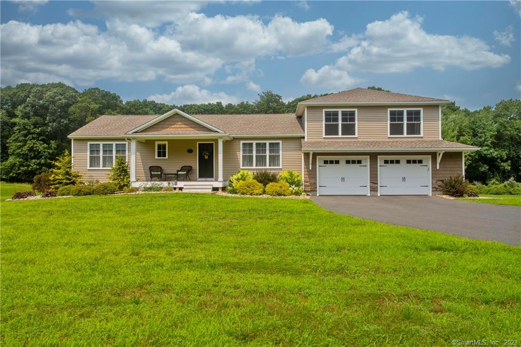 11 Mahoney Road East Windsor, CT 06088 - Photo 1 of 1 a front view of a house with a yard table and chairs