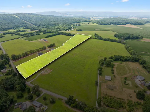 an aerial view of ocean with residential house
