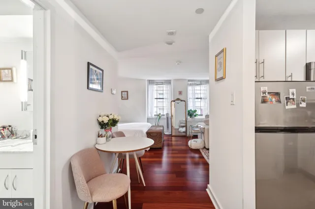 a view of a dining room with furniture and wooden floor