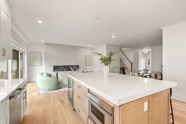 a kitchen with a stove a sink and a refrigerator