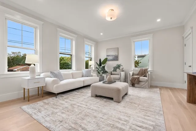a living room with furniture and windows