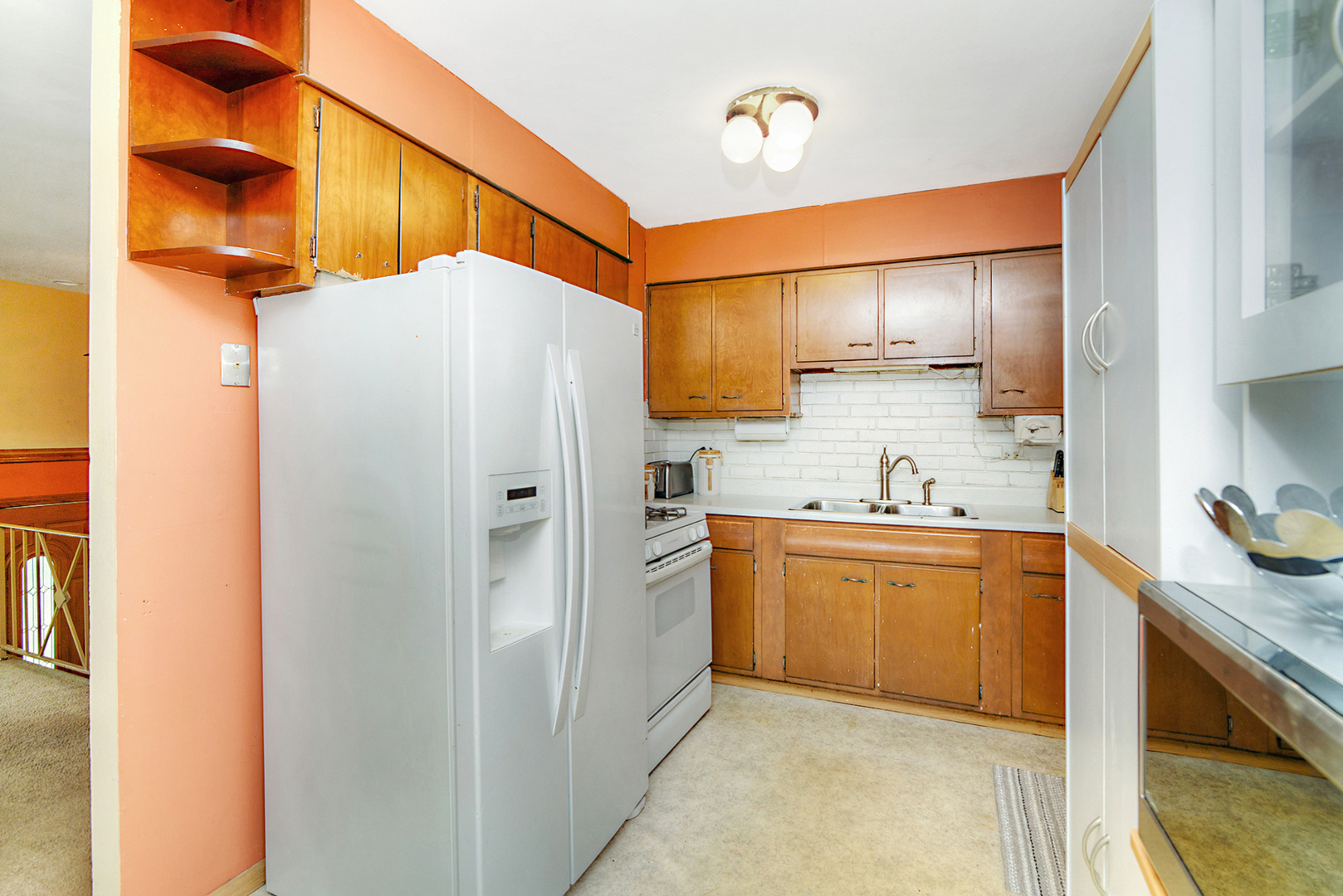 720 Terry Road Glendale Heights, IL 60139 - Photo 15 of 28 a kitchen with stainless steel appliances a refrigerator sink and cabinets