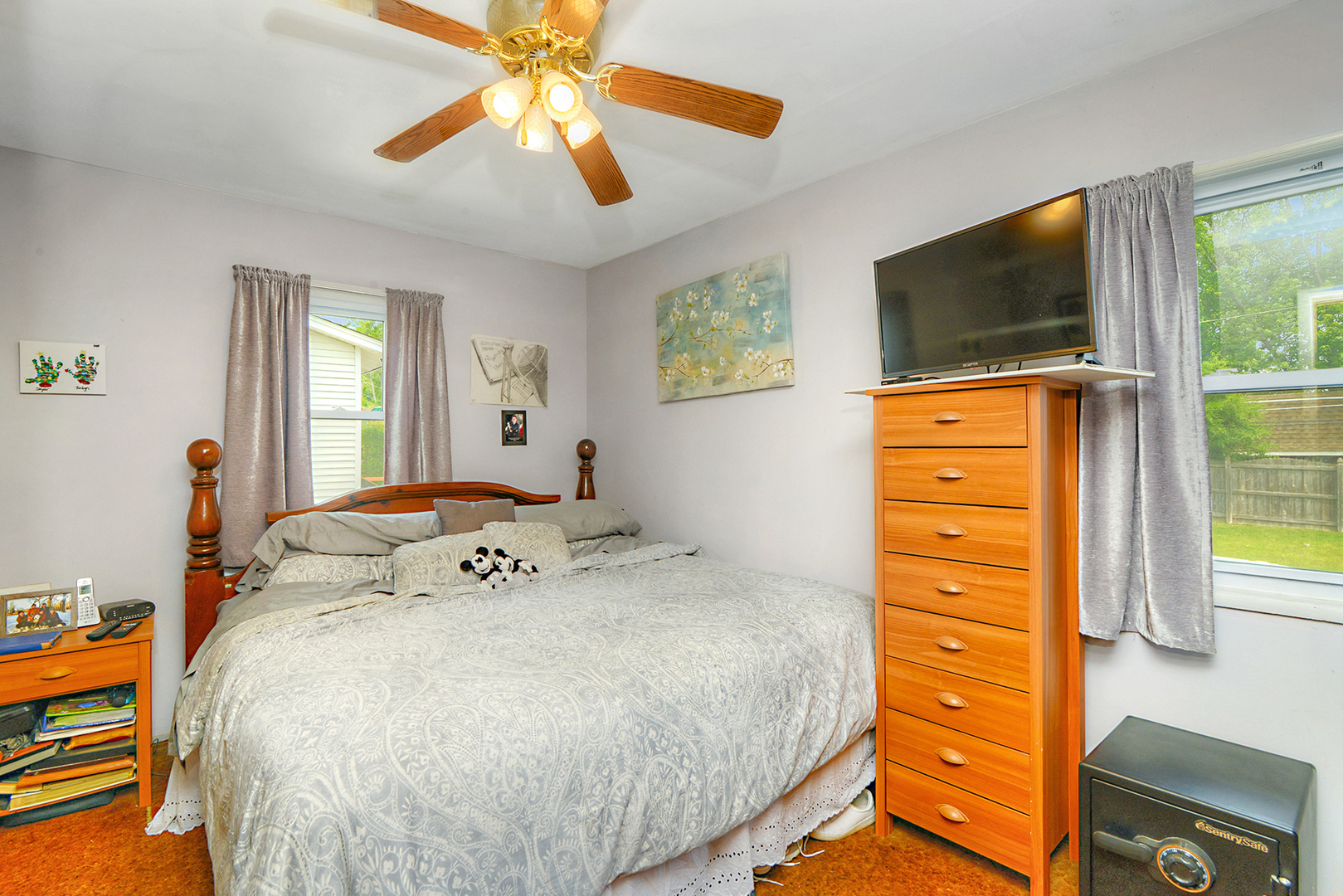 720 Terry Road Glendale Heights, IL 60139 - Photo 17 of 28 a bedroom with a bed and a flat screen tv