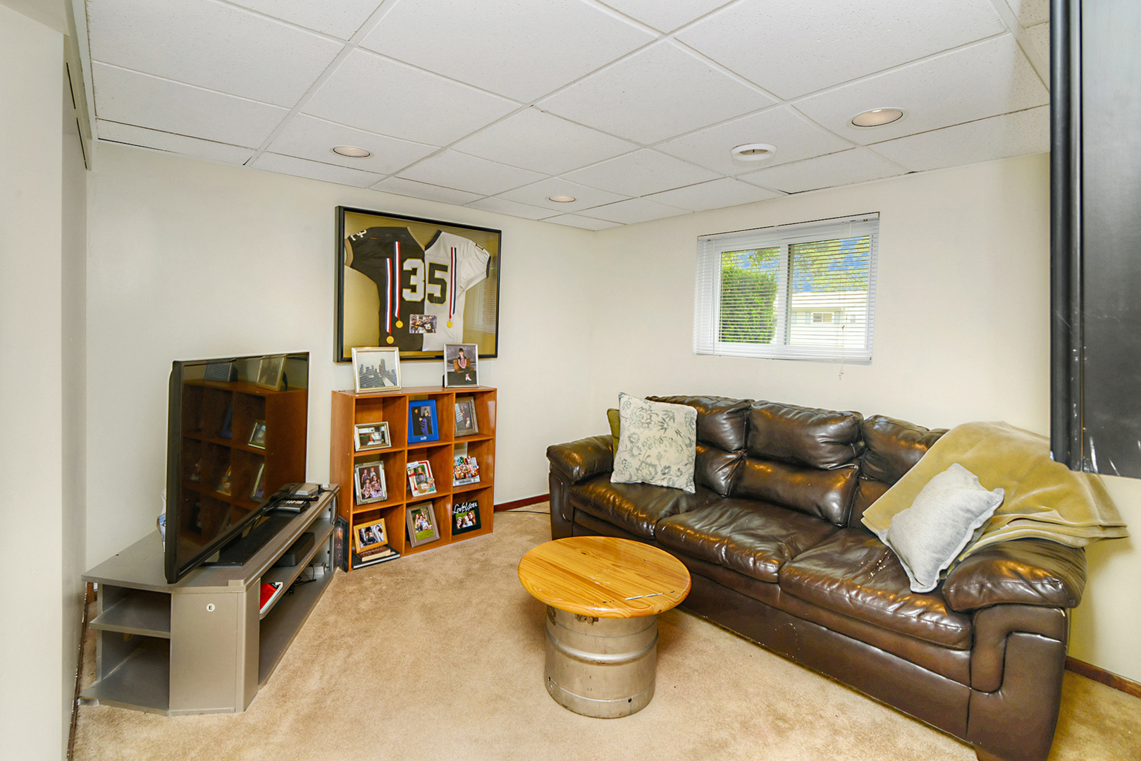 720 Terry Road Glendale Heights, IL 60139 - Photo 23 of 28 a living room with furniture and a flat screen tv