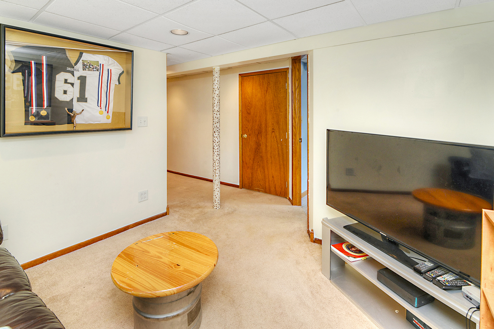 720 Terry Road Glendale Heights, IL 60139 - Photo 24 of 28 a view of a room with furniture and a flat screen tv