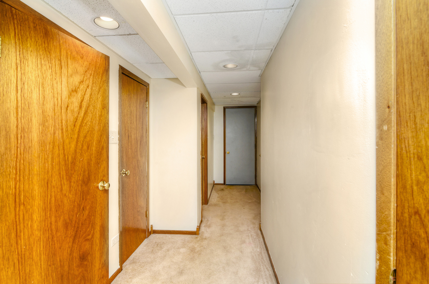 720 Terry Road Glendale Heights, IL 60139 - Photo 26 of 28 a view of a hallway with a bathroom and a shower