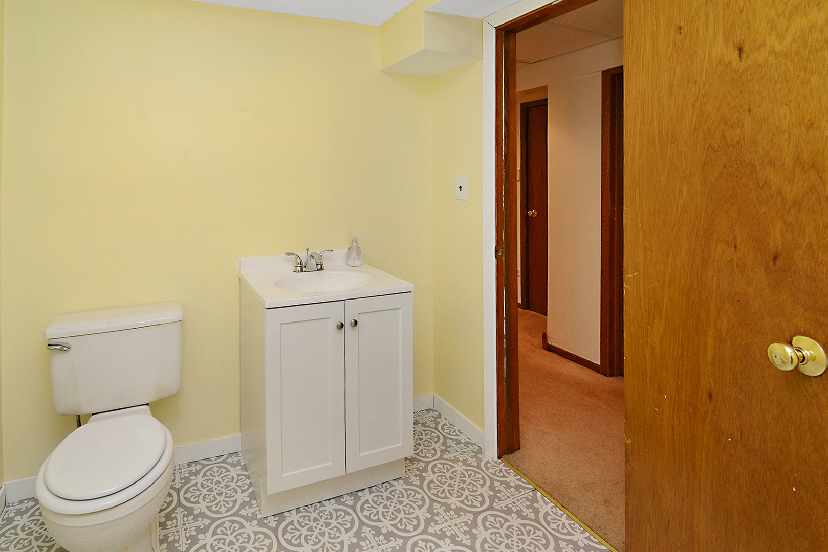 720 Terry Road Glendale Heights, IL 60139 - Photo 27 of 28 a bathroom with a sink and a toilet