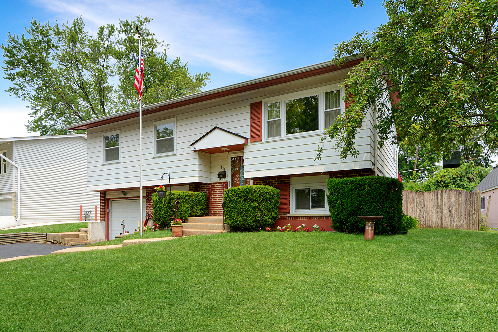 720 Terry Road Glendale Heights, IL 60139 - Photo 28 of 28 a front view of a house with a yard and garage