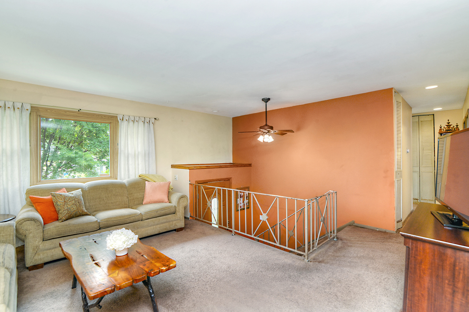 720 Terry Road Glendale Heights, IL 60139 - Photo 10 of 28 a living room with furniture and a window
