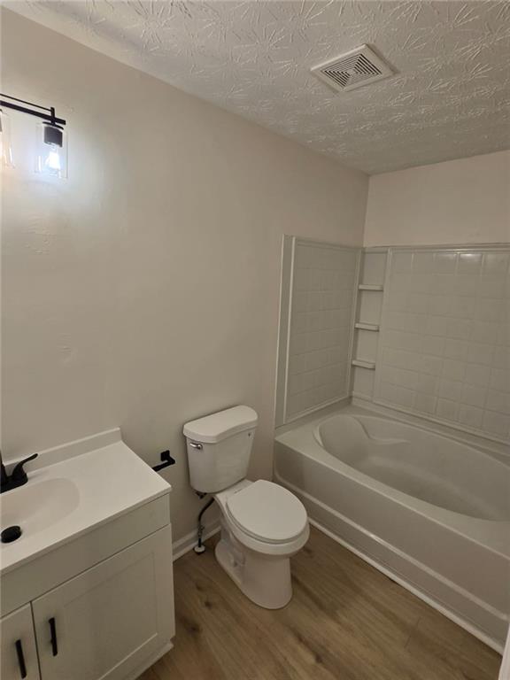2868 Vining Ridge Terrace Decatur, GA 30034 - Photo 7 of 16 a white toilet and tub sitting next to a bathroom sink
