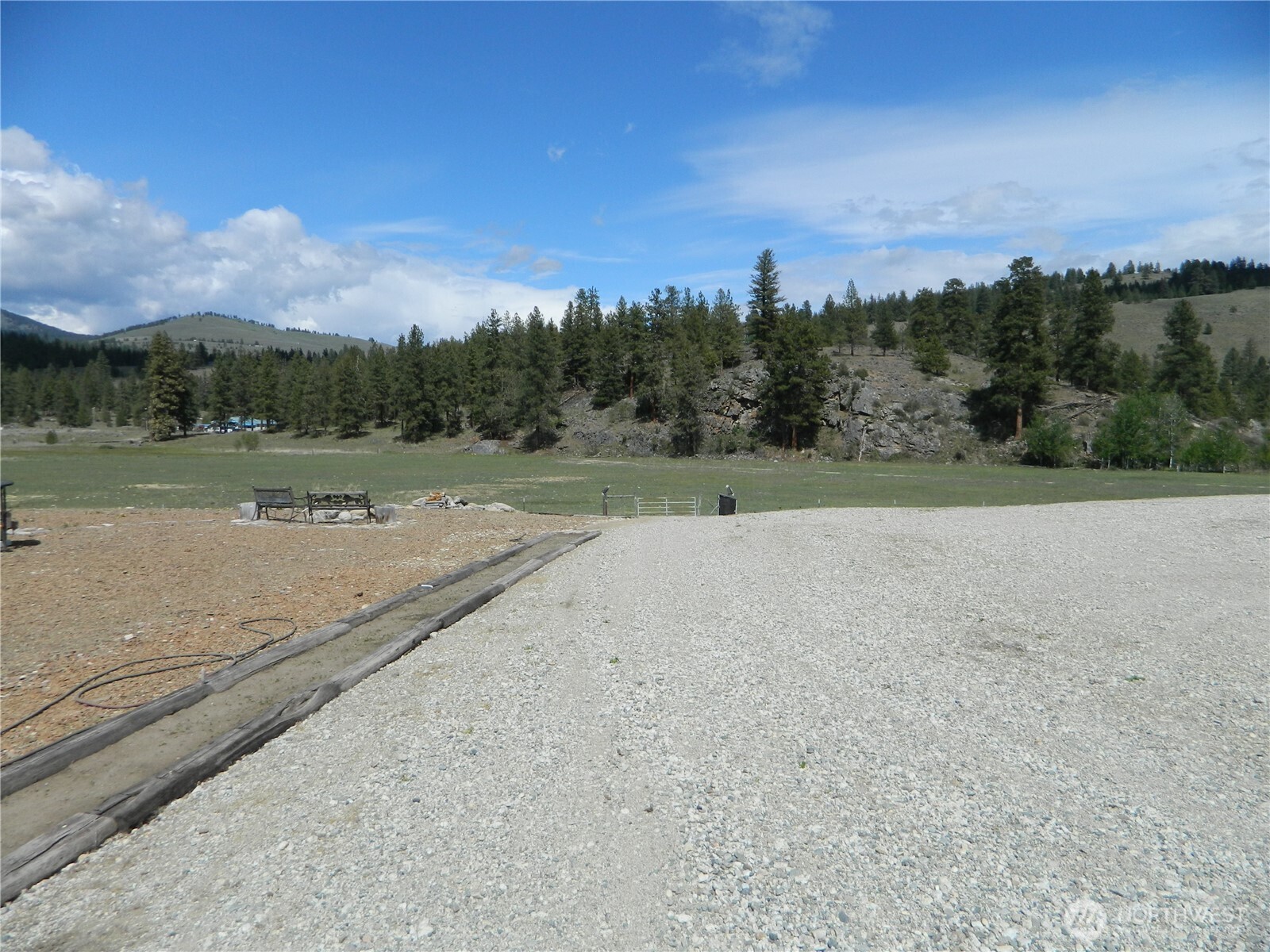 29 Duck Flats Road Tonasket, WA 98855 - Photo 11 of 25 a view of dirt field with trees in background