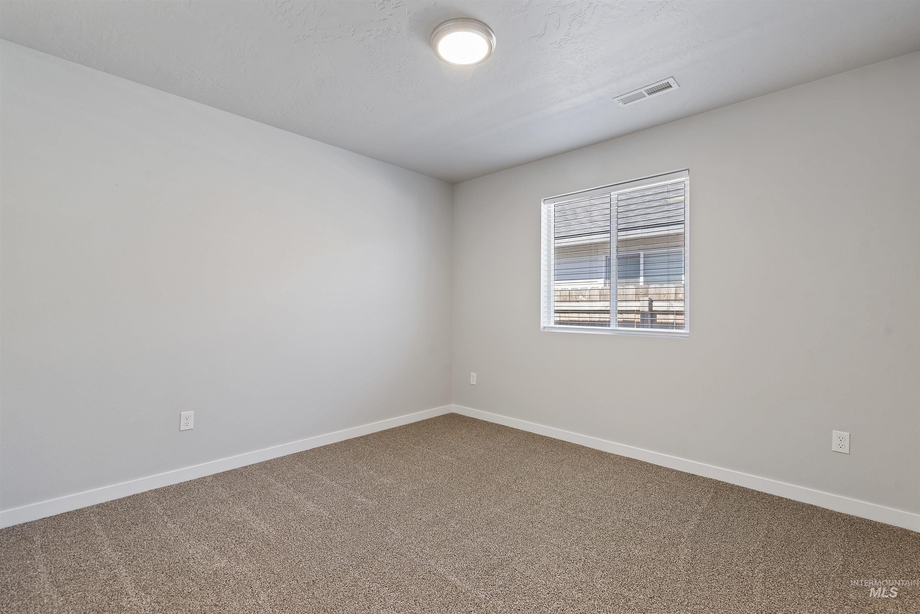 12703 West Fig Street Boise, ID 83713 - Photo 12 of 26 Empty room with baseboards and carpet
