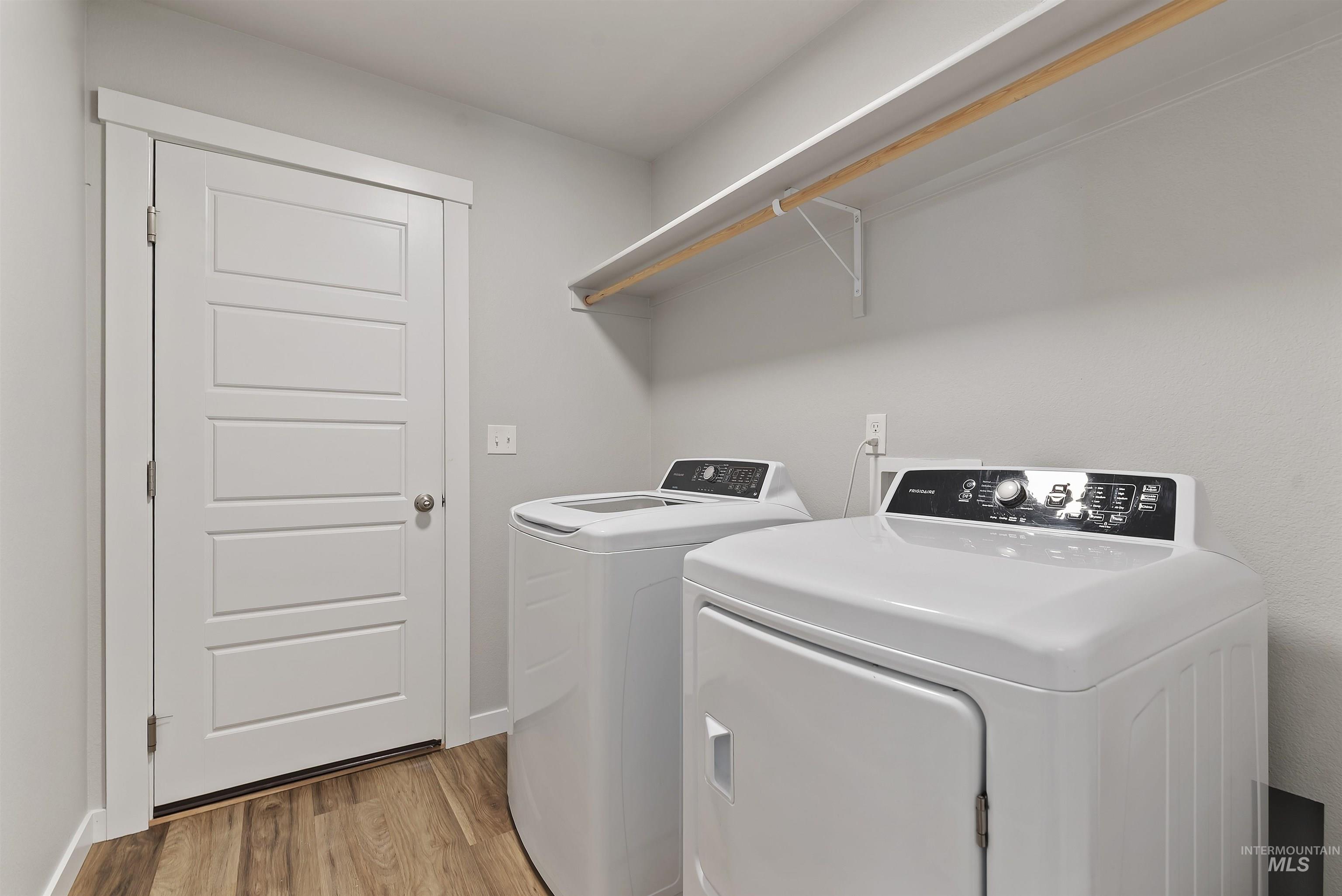 12703 West Fig Street Boise, ID 83713 - Photo 21 of 26 Laundry room featuring light wood-style flooring and independent washer and dryer