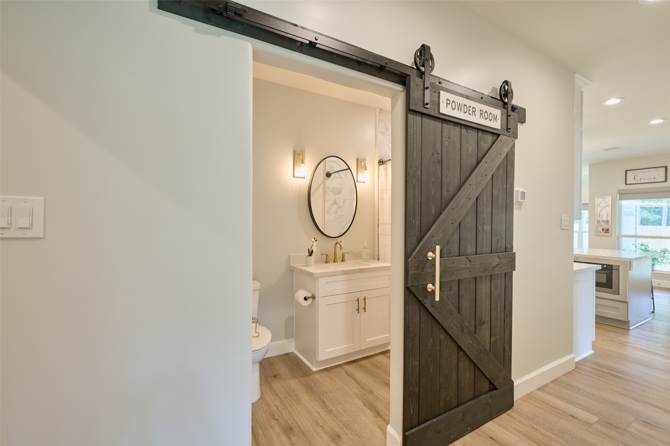 2218 Honea Egypt Road Magnolia, TX 77354 - Photo 37 of 50 Charming powder room with stylish barn door entry.