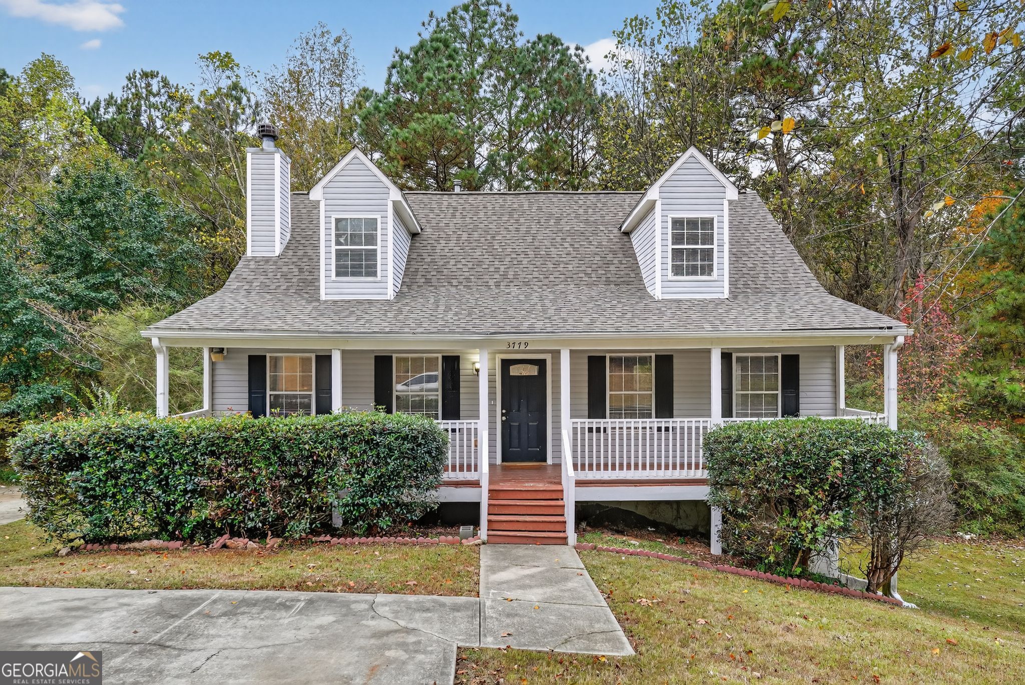 3779 Rolling Place Conley, GA 30288 - Photo 1 of 1 a front view of a house with a yard and potted plants