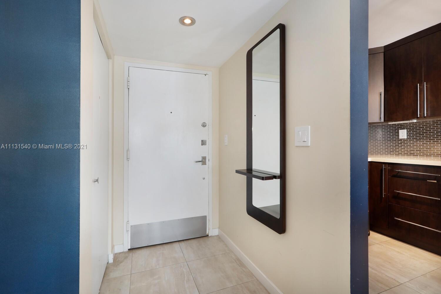 145 Southeast 25th Road, Unit 502 Miami, FL 33129 - Photo 3 of 24 a view of an entryway with wooden floor