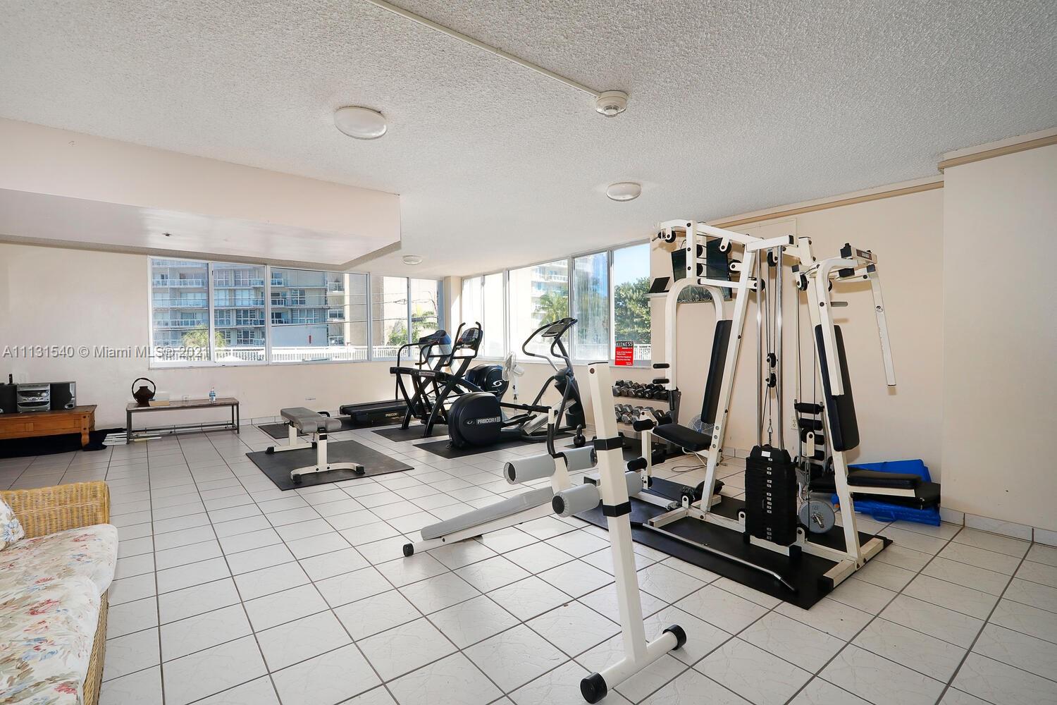 145 Southeast 25th Road, Unit 502 Miami, FL 33129 - Photo 23 of 24 a view of a room with gym equipment