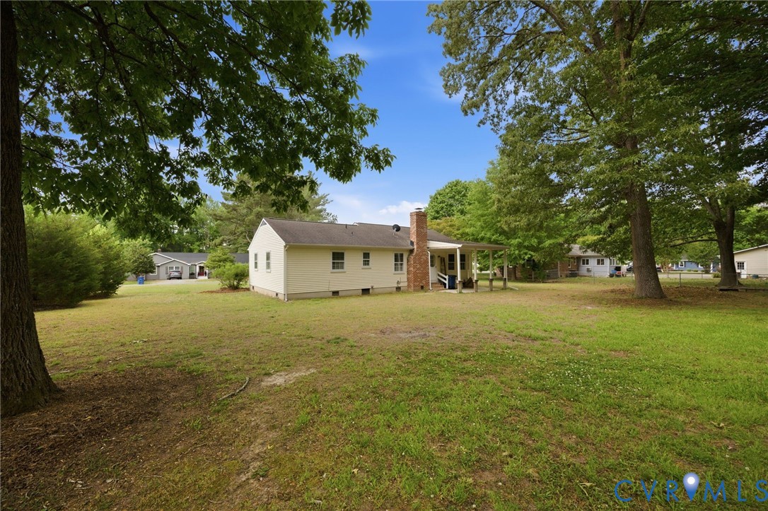 5991 Scott Road Gloucester, VA 23061 - Photo 9 of 35 Expansive backyard featuring a manicured lawn, est