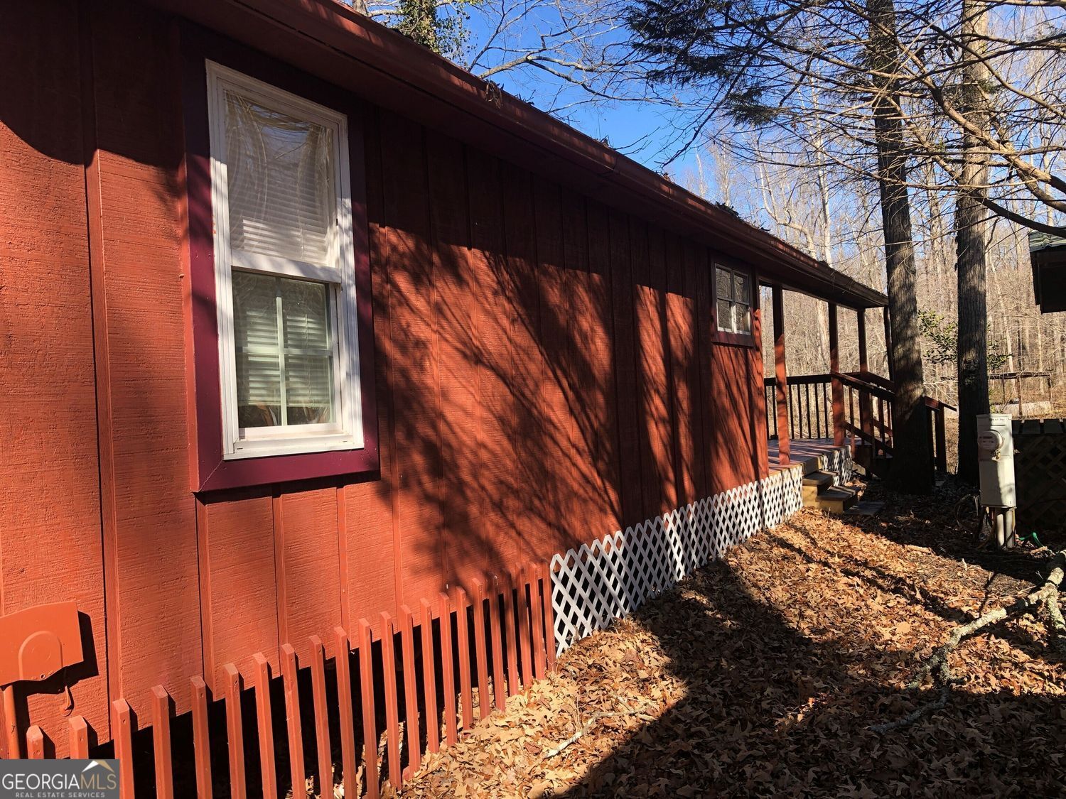 a view of a house with a small yard