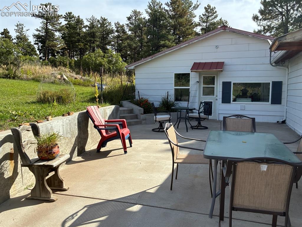 8201 Old San Isabel Road Rye, CO 81069 - Photo 25 of 30 a view of a patio with table and chairs and potted plants