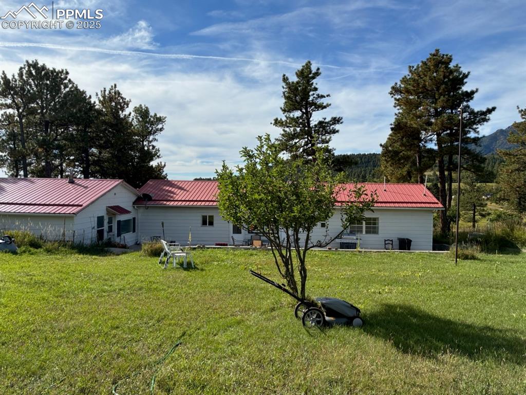 8201 Old San Isabel Road Rye, CO 81069 - Photo 29 of 30 a view of a house with a yard and sitting area