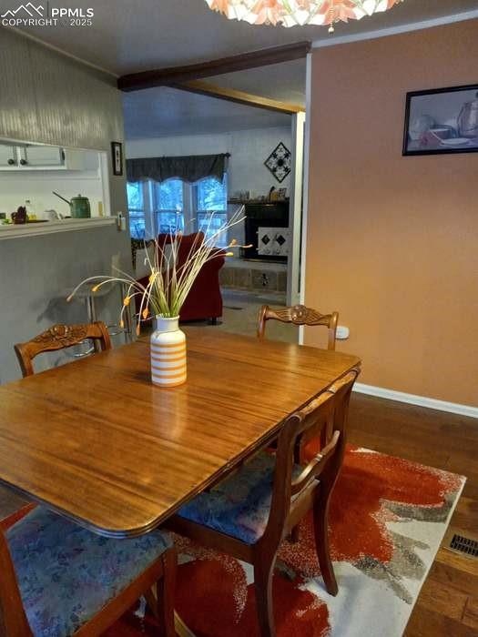 8201 Old San Isabel Road Rye, CO 81069 - Photo 3 of 30 a dining room with furniture and wooden floor