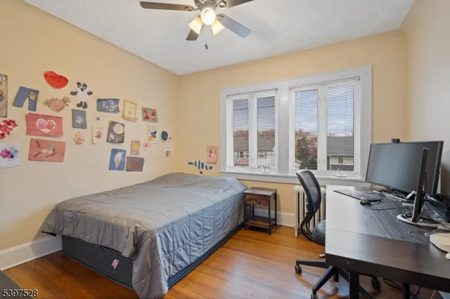 a bed room with a bed and a desk