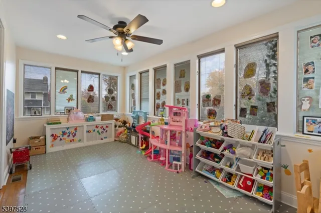 a living room with lots of furniture and a chandelier