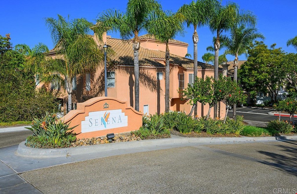 1340 Serena Circle, Unit 1 Chula Vista, CA 91910 - Photo 1 of 31 a front view of a house with a yard and potted plants