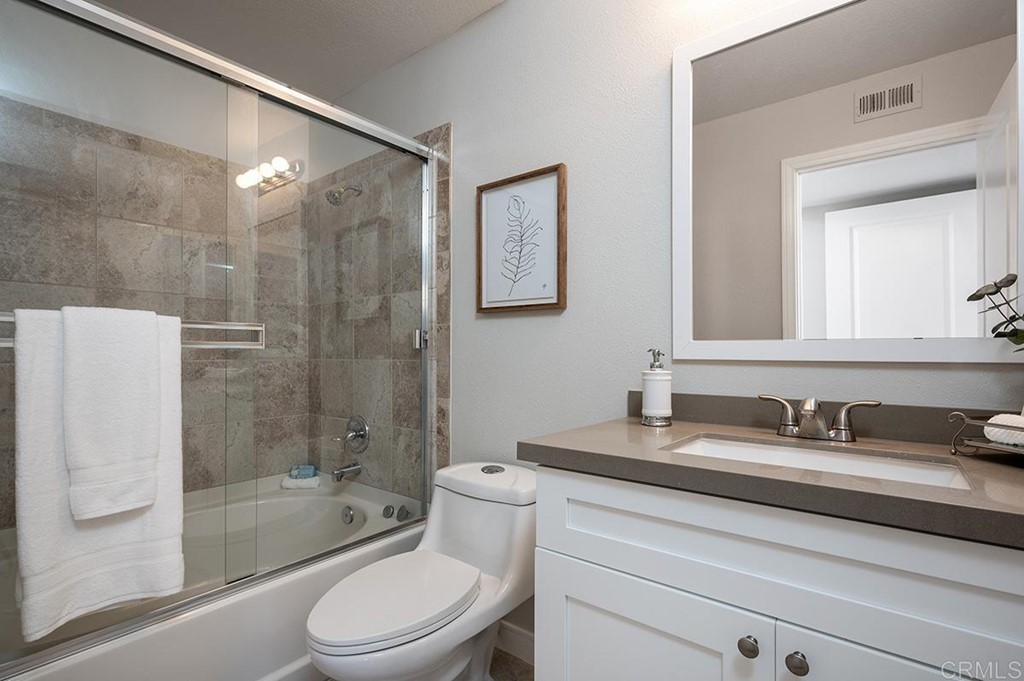 1340 Serena Circle, Unit 1 Chula Vista, CA 91910 - Photo 15 of 31 a bathroom with a sink a toilet and shower