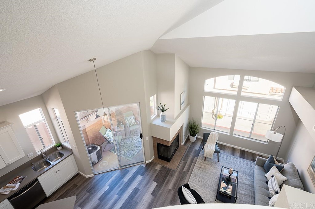 1340 Serena Circle, Unit 1 Chula Vista, CA 91910 - Photo 18 of 31 a living room with furniture and a fireplace