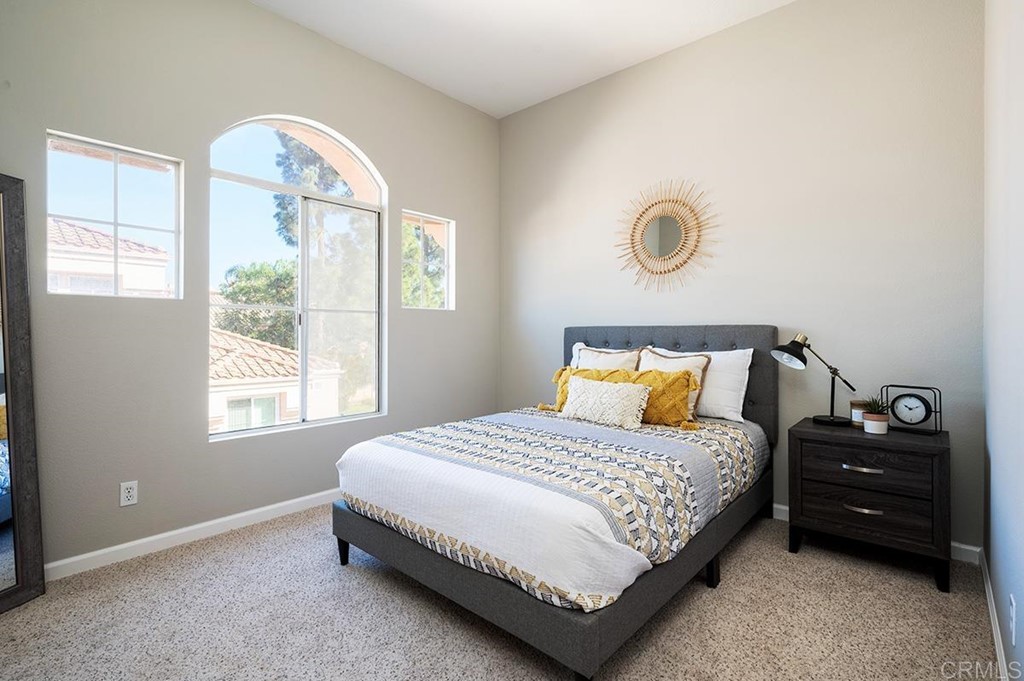 1340 Serena Circle, Unit 1 Chula Vista, CA 91910 - Photo 20 of 31 a bedroom with a bed and a window