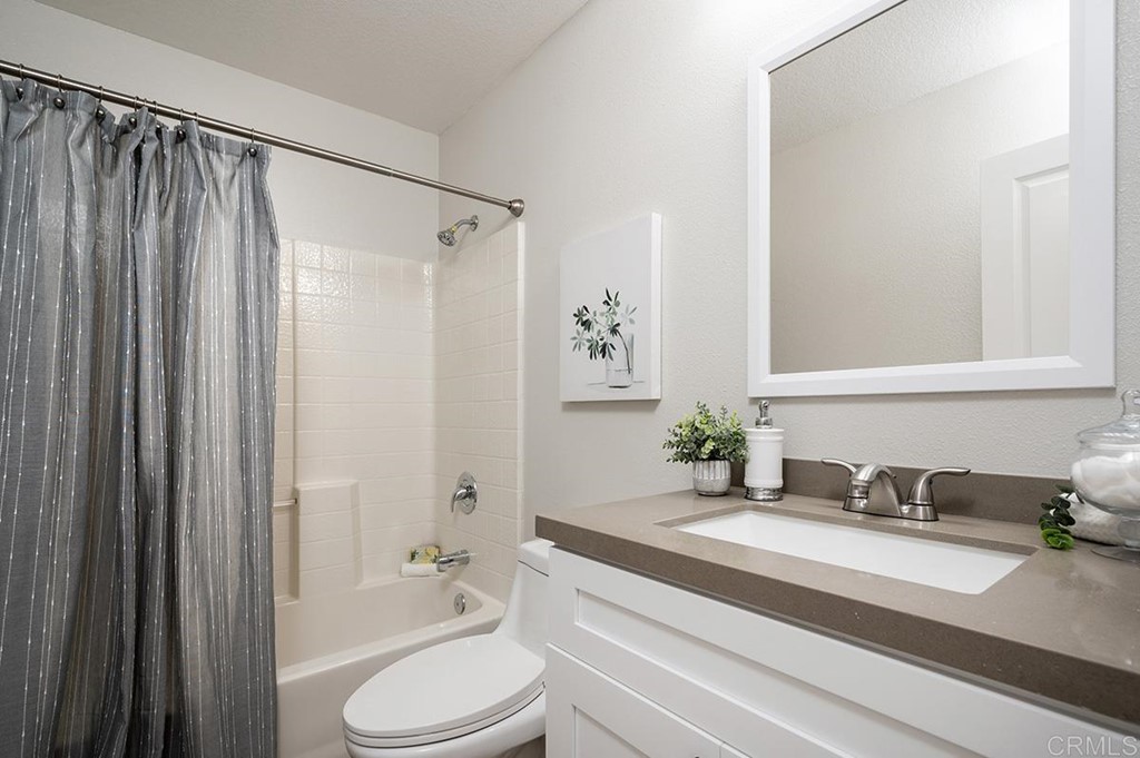 1340 Serena Circle, Unit 1 Chula Vista, CA 91910 - Photo 22 of 31 a bathroom with a sink toilet and shower